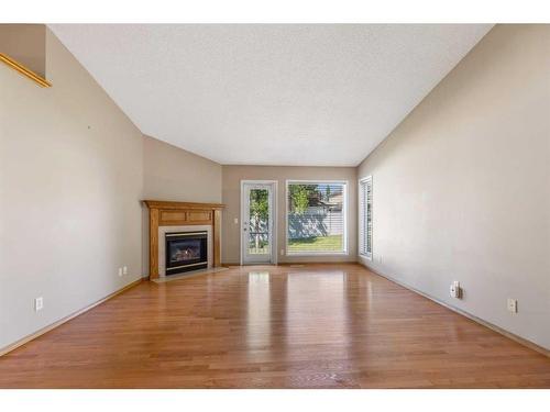 22 Douglasview Park Se, Calgary, AB - Indoor Photo Showing Living Room With Fireplace