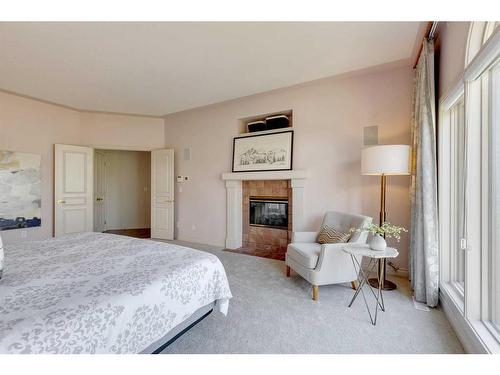 13007 Canso Place Sw, Calgary, AB - Indoor Photo Showing Bedroom With Fireplace