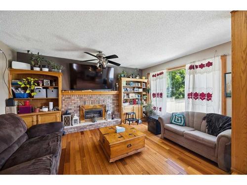 315 Hawkland Circle Nw, Calgary, AB - Indoor Photo Showing Living Room With Fireplace