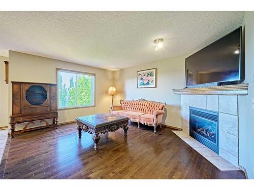 208 Tuscany Ridge Crescent Nw, Calgary, AB - Indoor Photo Showing Living Room With Fireplace