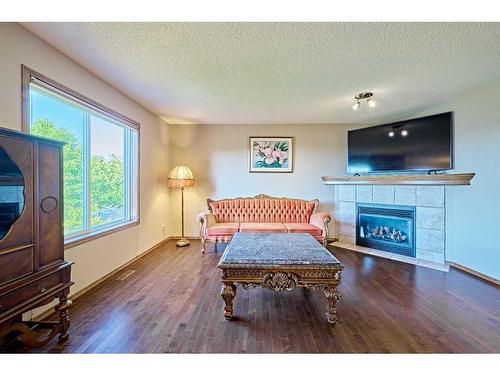 208 Tuscany Ridge Crescent Nw, Calgary, AB - Indoor Photo Showing Living Room With Fireplace