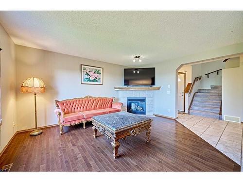 208 Tuscany Ridge Crescent Nw, Calgary, AB - Indoor Photo Showing Living Room With Fireplace