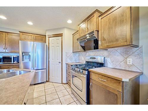 208 Tuscany Ridge Crescent Nw, Calgary, AB - Indoor Photo Showing Kitchen With Stainless Steel Kitchen With Double Sink