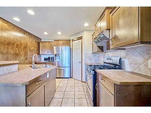 208 Tuscany Ridge Crescent Nw, Calgary, AB - Indoor Photo Showing Kitchen With Double Sink