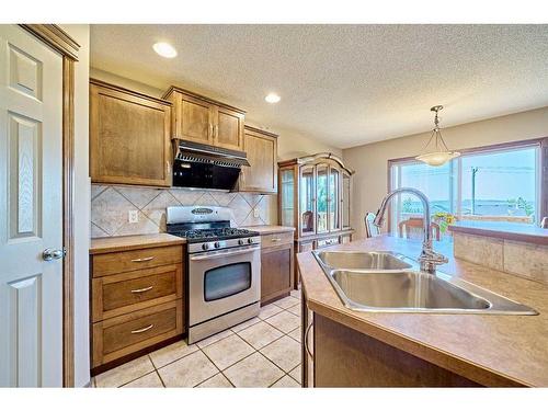 208 Tuscany Ridge Crescent Nw, Calgary, AB - Indoor Photo Showing Kitchen With Double Sink