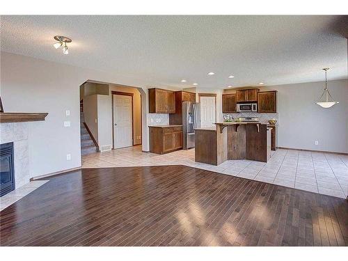 208 Tuscany Ridge Crescent Nw, Calgary, AB - Indoor With Fireplace