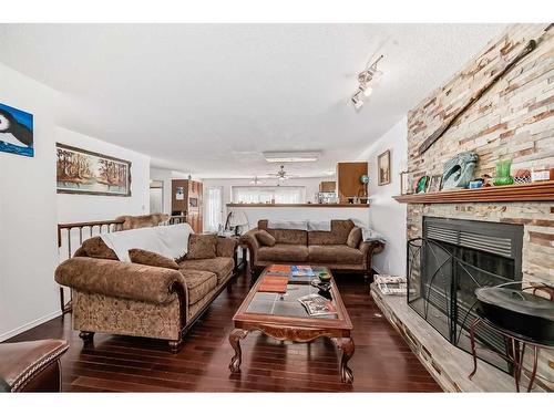 12 West Heights Drive, Didsbury, AB - Indoor Photo Showing Living Room With Fireplace