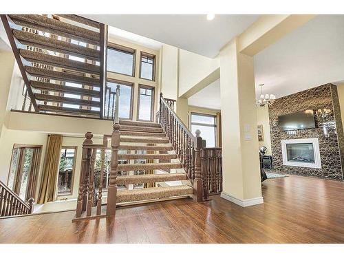 5 Elveden Point Sw, Calgary, AB - Indoor Photo Showing Other Room With Fireplace