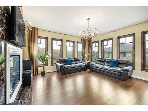 5 Elveden Point Sw, Calgary, AB - Indoor Photo Showing Living Room With Fireplace