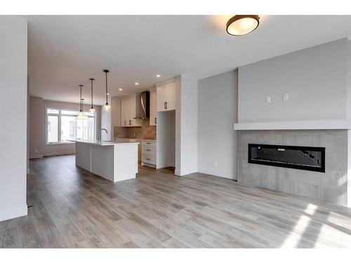 57 Royal Elm Green Nw, Calgary, AB - Indoor With Fireplace