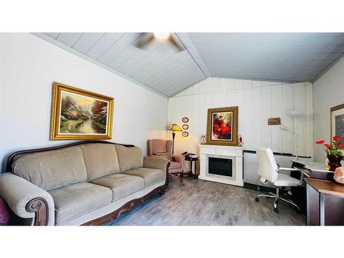 211-5404 10 Avenue Se, Calgary, AB - Indoor Photo Showing Living Room With Fireplace