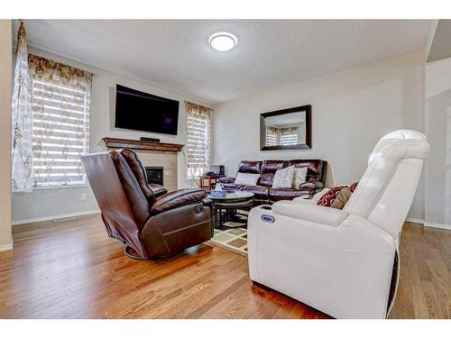 392 Nolan Hill Boulevard Nw, Calgary, AB - Indoor Photo Showing Living Room With Fireplace