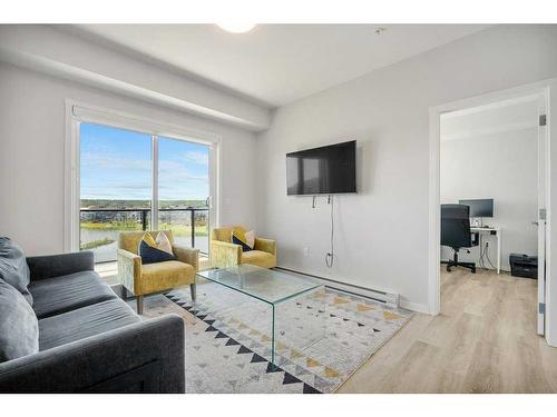 2306-42 Cranbrook Gardens Se, Calgary, AB - Indoor Photo Showing Living Room