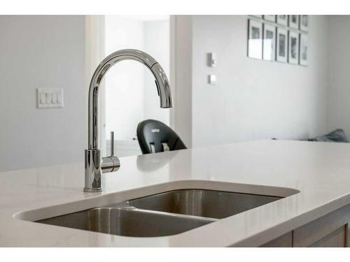 2306-42 Cranbrook Gardens Se, Calgary, AB - Indoor Photo Showing Kitchen With Double Sink