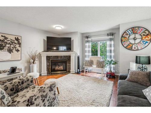 378 Arbour Grove Close Nw, Calgary, AB - Indoor Photo Showing Living Room With Fireplace
