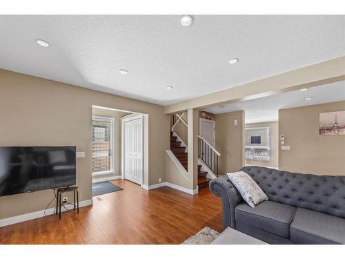 15 Beacham Way Nw, Calgary, AB - Indoor Photo Showing Living Room