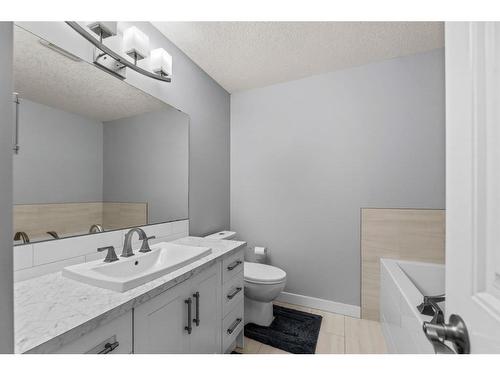 15 Beacham Way Nw, Calgary, AB - Indoor Photo Showing Bathroom