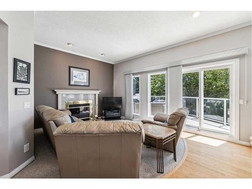 658 Hawkhill Place Nw, Calgary, AB - Indoor Photo Showing Living Room With Fireplace