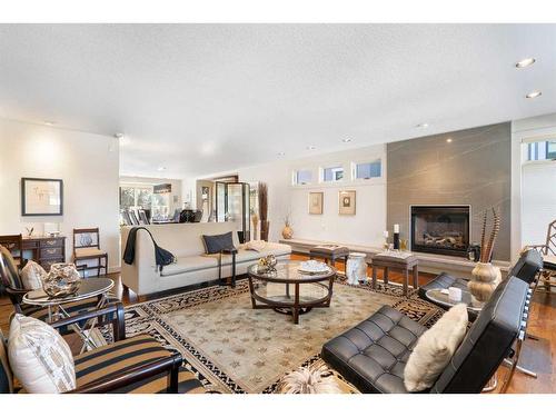 10931 Willowfern Drive Se, Calgary, AB - Indoor Photo Showing Living Room With Fireplace