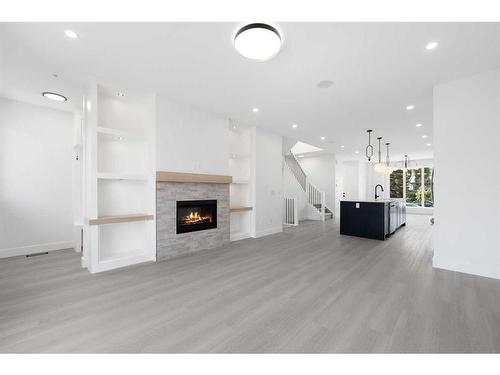 8522 47 Avenue Nw, Calgary, AB - Indoor Photo Showing Living Room With Fireplace