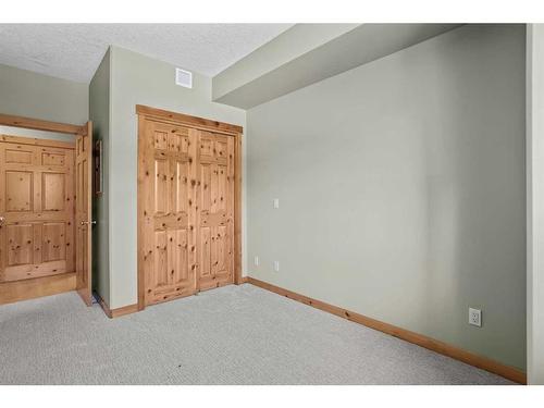 411-107 Armstrong Place, Canmore, AB - Indoor Photo Showing Other Room