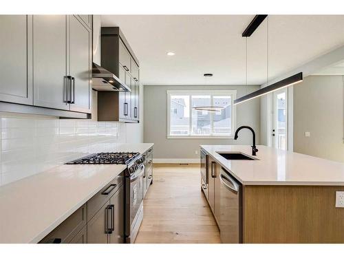 309 Coopersfield Rise Sw, Airdrie, AB - Indoor Photo Showing Kitchen With Upgraded Kitchen