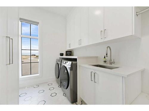 35 Windhorse Green, Rural Rocky View County, AB - Indoor Photo Showing Laundry Room