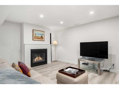 744 Mapleton Drive Se, Calgary, AB - Indoor Photo Showing Living Room With Fireplace