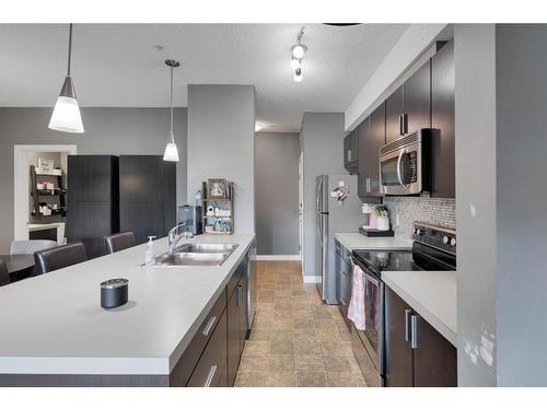 141-23 Millrise Drive Sw, Calgary, AB - Indoor Photo Showing Kitchen With Double Sink With Upgraded Kitchen