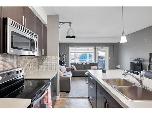 141-23 Millrise Drive Sw, Calgary, AB - Indoor Photo Showing Kitchen With Stainless Steel Kitchen With Double Sink With Upgraded Kitchen