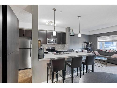 141-23 Millrise Drive Sw, Calgary, AB - Indoor Photo Showing Kitchen With Stainless Steel Kitchen With Upgraded Kitchen