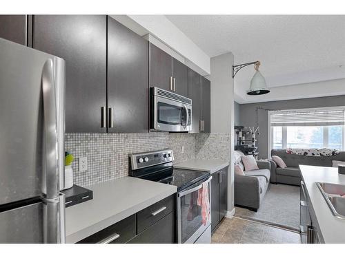 141-23 Millrise Drive Sw, Calgary, AB - Indoor Photo Showing Kitchen With Stainless Steel Kitchen With Double Sink With Upgraded Kitchen