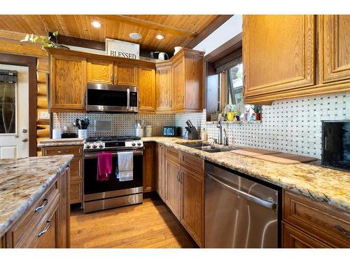 282167 Range Road 53, Rural Rocky View County, AB - Indoor Photo Showing Kitchen With Double Sink