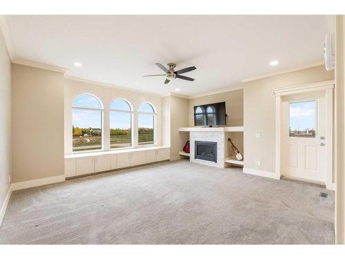 283185 Serenity Place, Rural Rocky View County, AB - Indoor Photo Showing Other Room With Fireplace