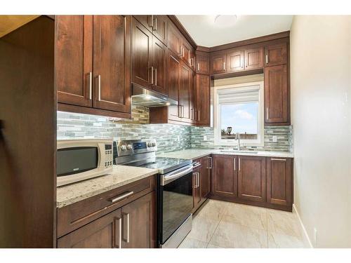 283185 Serenity Place, Rural Rocky View County, AB - Indoor Photo Showing Kitchen With Upgraded Kitchen