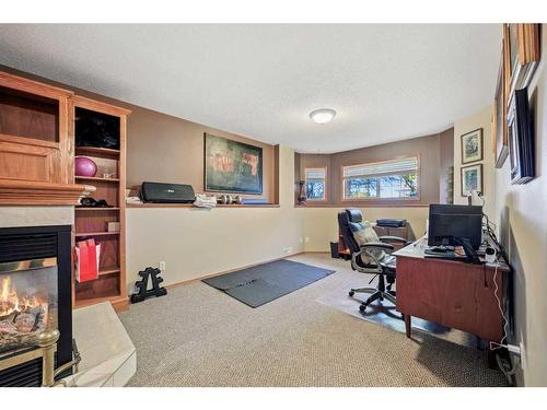 7 Silver Creek Boulevard Nw, Airdrie, AB - Indoor Photo Showing Office With Fireplace