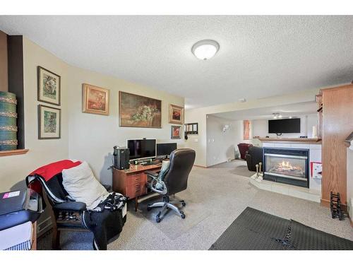 7 Silver Creek Boulevard Nw, Airdrie, AB - Indoor With Fireplace