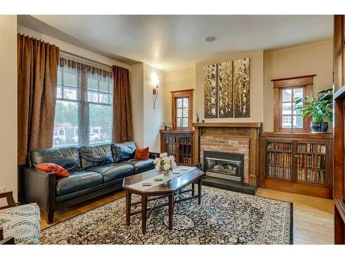 4002 Elbow Drive Sw, Calgary, AB - Indoor Photo Showing Living Room With Fireplace