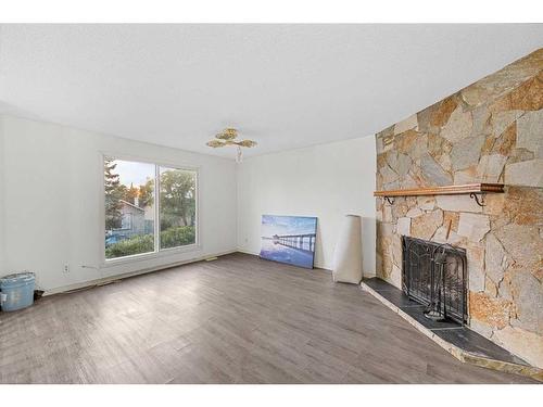 103 Castleridge Road Ne, Calgary, AB - Indoor Photo Showing Living Room With Fireplace