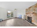 103 Castleridge Road Ne, Calgary, AB  - Indoor Photo Showing Living Room With Fireplace 