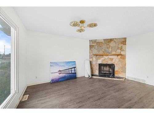 103 Castleridge Road Ne, Calgary, AB - Indoor Photo Showing Living Room With Fireplace