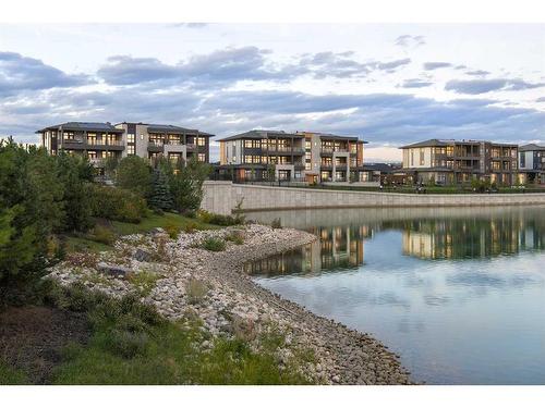 101-180 Marina Cove Se, Calgary, AB - Outdoor With Body Of Water