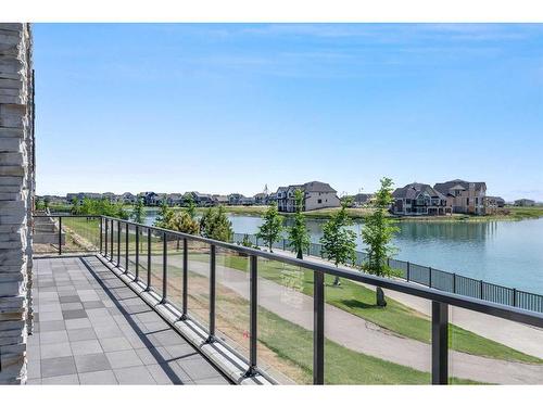 101-180 Marina Cove Se, Calgary, AB - Outdoor With Body Of Water With View