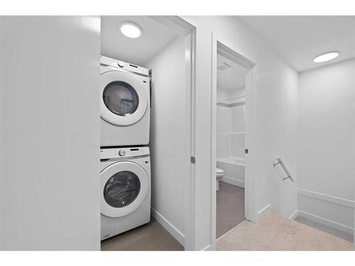 #212-857 Belmont Drive Sw, Calgary, AB - Indoor Photo Showing Laundry Room