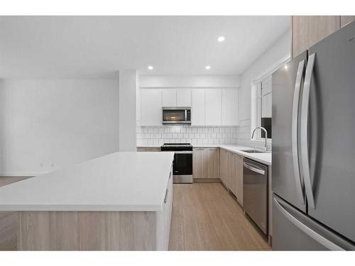 #212-857 Belmont Drive Sw, Calgary, AB - Indoor Photo Showing Kitchen With Upgraded Kitchen