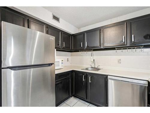 307-1900 25A Street Sw, Calgary, AB - Indoor Photo Showing Kitchen With Stainless Steel Kitchen