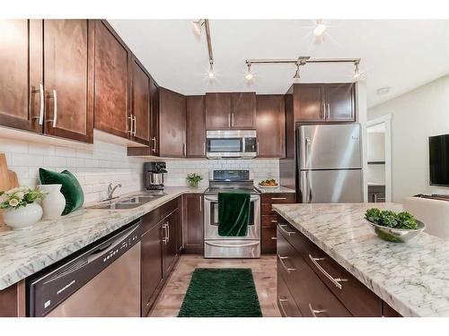 705 Mckenzie Towne Square Se, Calgary, AB - Indoor Photo Showing Kitchen With Double Sink