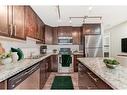 705 Mckenzie Towne Square Se, Calgary, AB  - Indoor Photo Showing Kitchen With Double Sink 