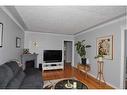 223 31 Avenue Ne, Calgary, AB  - Indoor Photo Showing Living Room With Fireplace 