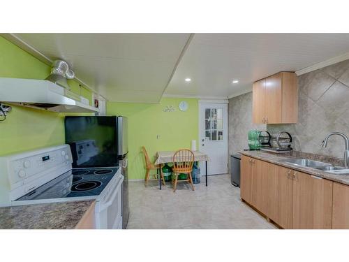 4855 Rundlewood Drive Ne, Calgary, AB - Indoor Photo Showing Kitchen With Double Sink